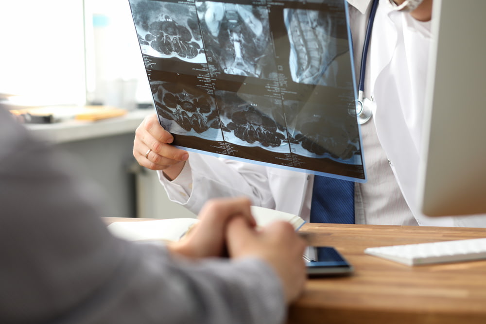 Doctor checking patient's x-ray