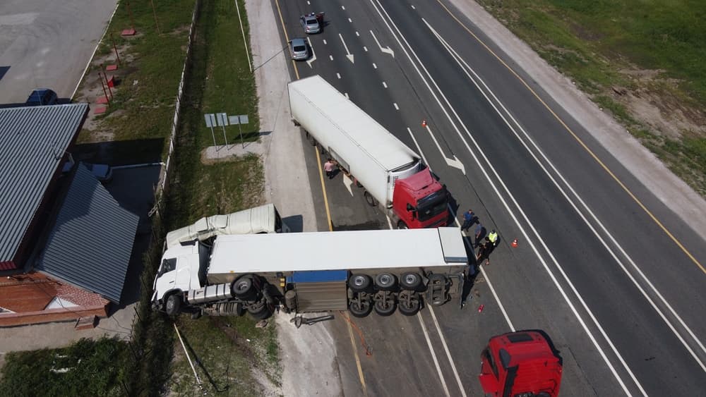 Two crashed trucks on the road