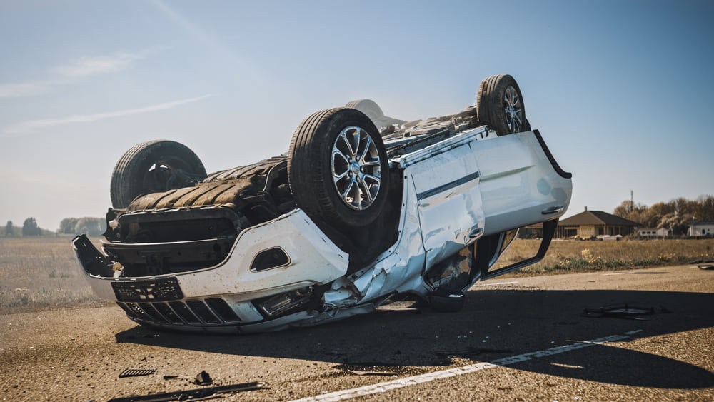 Car overturned on the road after an accident