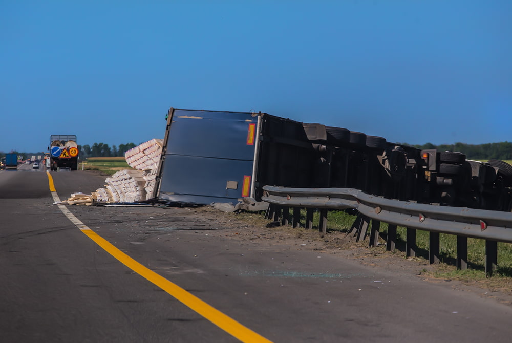 Truck overturned on the road after crash