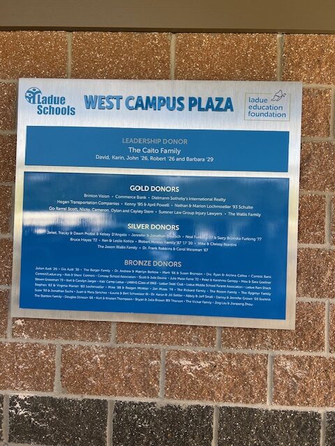 plaque reading West Campus Plaza with names of donors listed