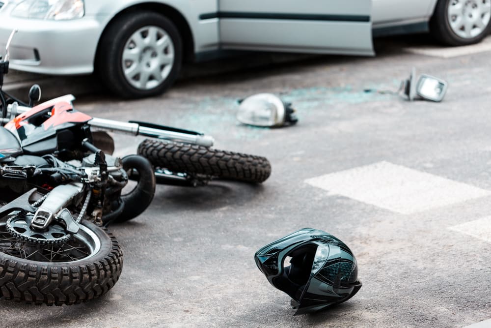 Motorcycle overturned after colliding with a car